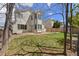 Backyard showcasing a two-story home and landscaping at 8985 Edgewood Ln, Highlands Ranch, CO 80130