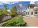 A beautifully maintained backyard featuring a lush lawn and privacy fence, perfect for outdoor relaxation and entertaining at 8985 Edgewood Ln, Highlands Ranch, CO 80130