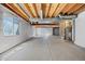 Unfinished basement with concrete floors and exposed ceiling at 8985 Edgewood Ln, Highlands Ranch, CO 80130