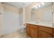 Bathroom featuring vanity and shower-tub combo at 8985 Edgewood Ln, Highlands Ranch, CO 80130