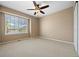 Bright bedroom with large window and a ceiling fan at 8985 Edgewood Ln, Highlands Ranch, CO 80130