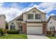 Traditional two-story home with a manicured front lawn and a two-car garage at 8985 Edgewood Ln, Highlands Ranch, CO 80130
