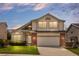 Charming two-story home with a well-manicured lawn and a brick-accented facade at 8985 Edgewood Ln, Highlands Ranch, CO 80130