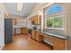 Kitchen featuring granite countertops, stainless steel appliances, oak cabinets, and a built-in workstation at 8985 Edgewood Ln, Highlands Ranch, CO 80130
