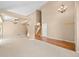 Expansive open-concept living space with neutral decor, wood floors, and lots of light at 8985 Edgewood Ln, Highlands Ranch, CO 80130