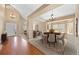 Open-concept living and dining area with elegant decor and plenty of natural light at 8985 Edgewood Ln, Highlands Ranch, CO 80130