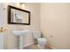 Bright powder room featuring pedestal sink at 8985 Edgewood Ln, Highlands Ranch, CO 80130