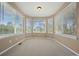 Bright sitting area featuring bay windows with views of the outdoors and plenty of natural light at 8985 Edgewood Ln, Highlands Ranch, CO 80130