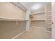 Walk-in closet featuring neutral colored carpet and adjustable shelving at 8985 Edgewood Ln, Highlands Ranch, CO 80130