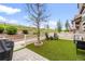 Inviting backyard with artificial turf, a paved patio, and a lovely view of the surrounding landscape at 3502 Nez Perce Trl, Castle Rock, CO 80109