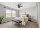 Inviting bedroom with soft neutral tones, comfortable bed, and ample natural light, creating a peaceful retreat at 3502 Nez Perce Trl, Castle Rock, CO 80109