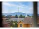 Beautiful mountain view from a window of a house in a residential neighborhood on a sunny day at 3502 Nez Perce Trl, Castle Rock, CO 80109