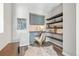Cozy office nook with built-in desk, shelves, and soft chair, creating a functional and stylish workspace at 3502 Nez Perce Trl, Castle Rock, CO 80109