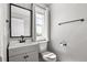 Clean powder room features modern fixtures, vanity, and bright lighting, offering a functional and stylish space at 3502 Nez Perce Trl, Castle Rock, CO 80109