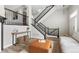 Spacious foyer with staircase, console table, neutral colors, and contemporary design at 3502 Nez Perce Trl, Castle Rock, CO 80109