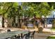Outdoor dining area with metal chairs and landscaping at building at 2193 Arapahoe St # 15, Denver, CO 80205