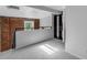 This loft area has exposed brick, natural light, and convenient closet access at 2193 Arapahoe St # 15, Denver, CO 80205