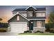 Charming two-story home with a welcoming facade, a two car garage, and meticulous landscaping at 3343 N Catawba Way, Aurora, CO 80019