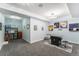 Finished basement game room with game tables, colorful wall decor, and modern lighting at 18984 W 85Th Blf, Arvada, CO 80007