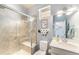 Updated bathroom featuring a glass shower with a bench and modern fixtures at 18984 W 85Th Blf, Arvada, CO 80007