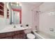 Cozy bathroom features a vanity, toilet, and tiled tub-shower combination at 11922 Bellaire St # F, Thornton, CO 80233