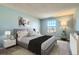 Calming primary bedroom with a large window and a soft, cozy aesthetic at 11922 Bellaire St # F, Thornton, CO 80233