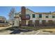 Charming exterior view of the building with a brick chimney and balcony at 11922 Bellaire St # F, Thornton, CO 80233