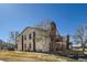 Attractive two-story townhouse with a brick chimney and charming outdoor seating area at 11922 Bellaire St # F, Thornton, CO 80233