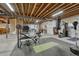 Spacious basement featuring workout area with unfinished ceiling and concrete flooring at 26566 E Peakview Dr, Aurora, CO 80016