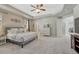 Spacious bedroom featuring a trey ceiling, large windows, and plush carpeting at 26566 E Peakview Dr, Aurora, CO 80016