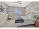 Comfortable bedroom with neutral colors, ceiling fan, and natural light at 26566 E Peakview Dr, Aurora, CO 80016