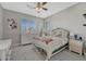 Bright bedroom with neutral walls, shutters, and modern furnishings at 26566 E Peakview Dr, Aurora, CO 80016