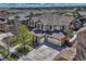 Beautiful two-story home featuring a two-car garage, well-manicured lawn, and lovely landscaping at 26566 E Peakview Dr, Aurora, CO 80016