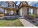 Charming two-story home featuring a welcoming porch and tasteful stone accents at 26566 E Peakview Dr, Aurora, CO 80016