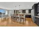 The kitchen features a large island with seating and stainless steel appliances at 26566 E Peakview Dr, Aurora, CO 80016