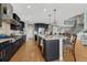This kitchen features a large center island with dark wood cabinets at 26566 E Peakview Dr, Aurora, CO 80016