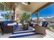 Inviting covered patio with comfortable seating and stylish outdoor decor at 26566 E Peakview Dr, Aurora, CO 80016
