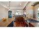 Gourmet kitchen featuring stainless steel appliances, granite counters, dark cabinetry, and hardwood floors at 4913 Cathay Ct, Denver, CO 80249