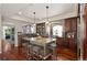 Modern kitchen featuring a granite island with seating and stainless steel appliances at 4913 Cathay Ct, Denver, CO 80249