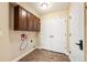 Functional laundry room with ample cabinet space, tile floors and utility connections at 4913 Cathay Ct, Denver, CO 80249