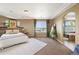 Bedroom with neutral paint, trey ceilings, carpet, lots of natural light and an archway at 4913 Cathay Ct, Denver, CO 80249