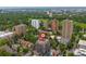 Aerial shot of apartment building in a park-like setting with nearby city amenities at 1150 Vine St # 306, Denver, CO 80206