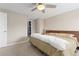 Relaxing bedroom with ceiling fan, natural light, and closet access at 1150 Vine St # 306, Denver, CO 80206