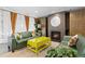 Inviting living room with natural light, a cozy fireplace, comfortable seating, and unique yellow coffee table at 1150 Vine St # 306, Denver, CO 80206