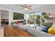 Cozy living room showcasing comfortable seating, a balcony, and a glimpse into the bedroom at 1150 Vine St # 306, Denver, CO 80206
