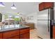 Bright living room features stainless steel appliances, a breakfast bar and a walk-out patio at 1150 Vine St # 306, Denver, CO 80206