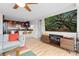 Open-concept living room featuring modern furniture, a glimpse into the kitchen, and hardwood floors at 1150 Vine St # 306, Denver, CO 80206