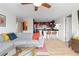 Bright living room with a gray couch, colorful pillows, and an open view to the kitchen at 1150 Vine St # 306, Denver, CO 80206
