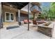Ground-level patio lounge area offers outdoor seating, a cozy space for relaxation, and decorative stone retaining wall at 1150 Vine St # 306, Denver, CO 80206