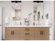 Dual sink bathroom vanity with a modern, minimalist design and stylish fixtures at 3130 Wyandot St, Denver, CO 80211